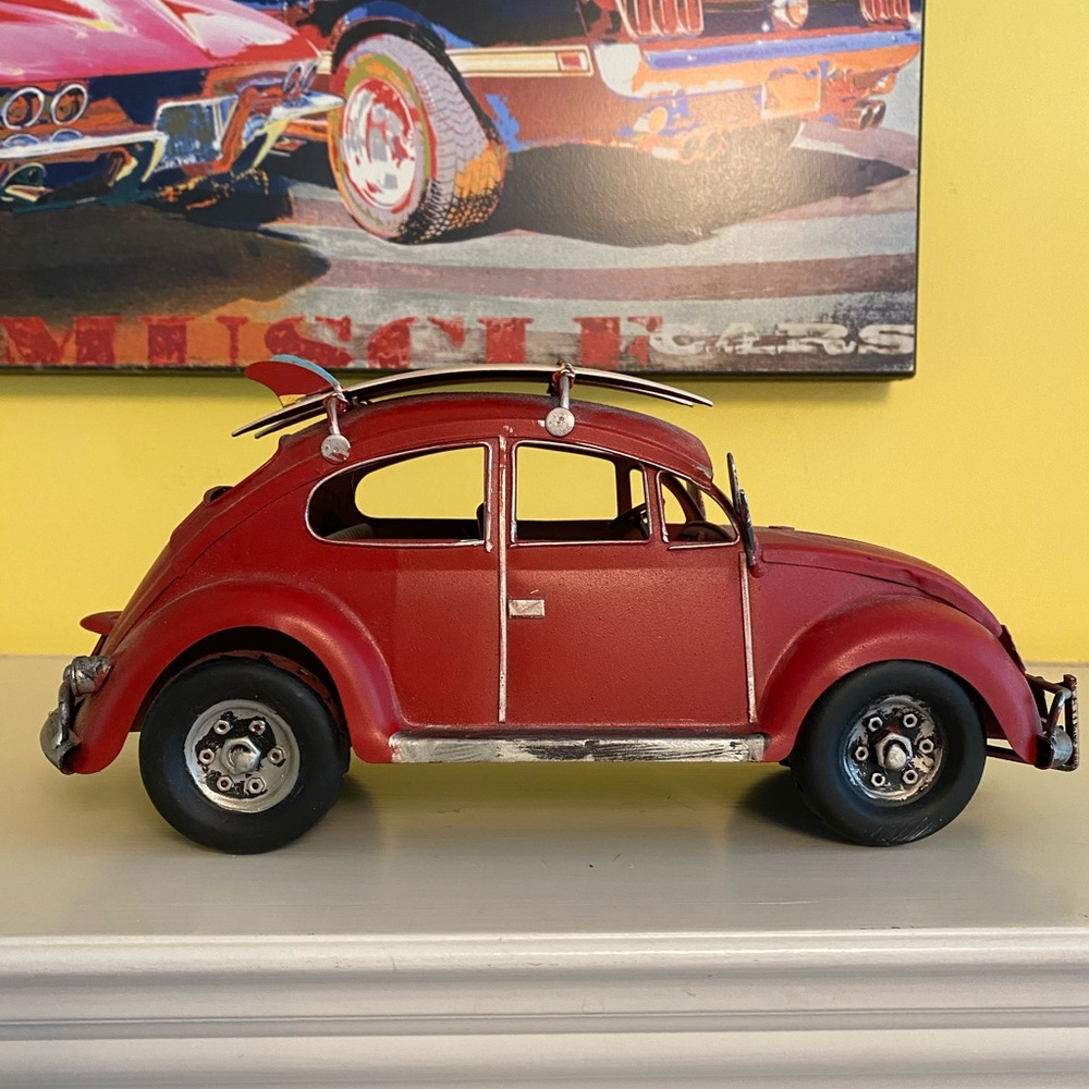 Red metal VW with surfboards like new